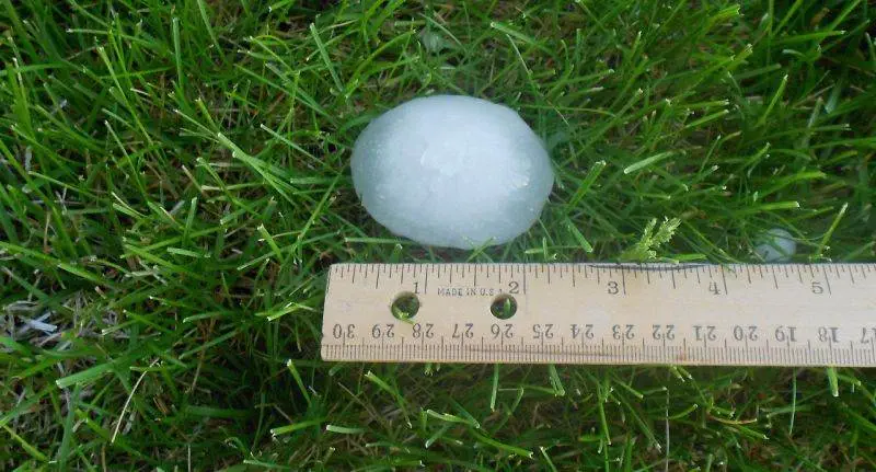 a hail stone measuring 2 inches that could damage a roof
