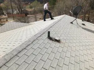 Elite Roofing & Solar staff having a roof inspection on top of a roof in Denver, CO