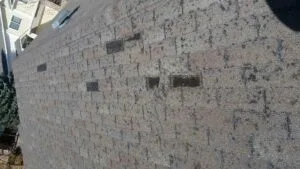 photo of a roof with hail damage Elite Roofing & Solar in Denver, CO