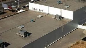 An image of a roof that needs a commercial roof replacement in Denver